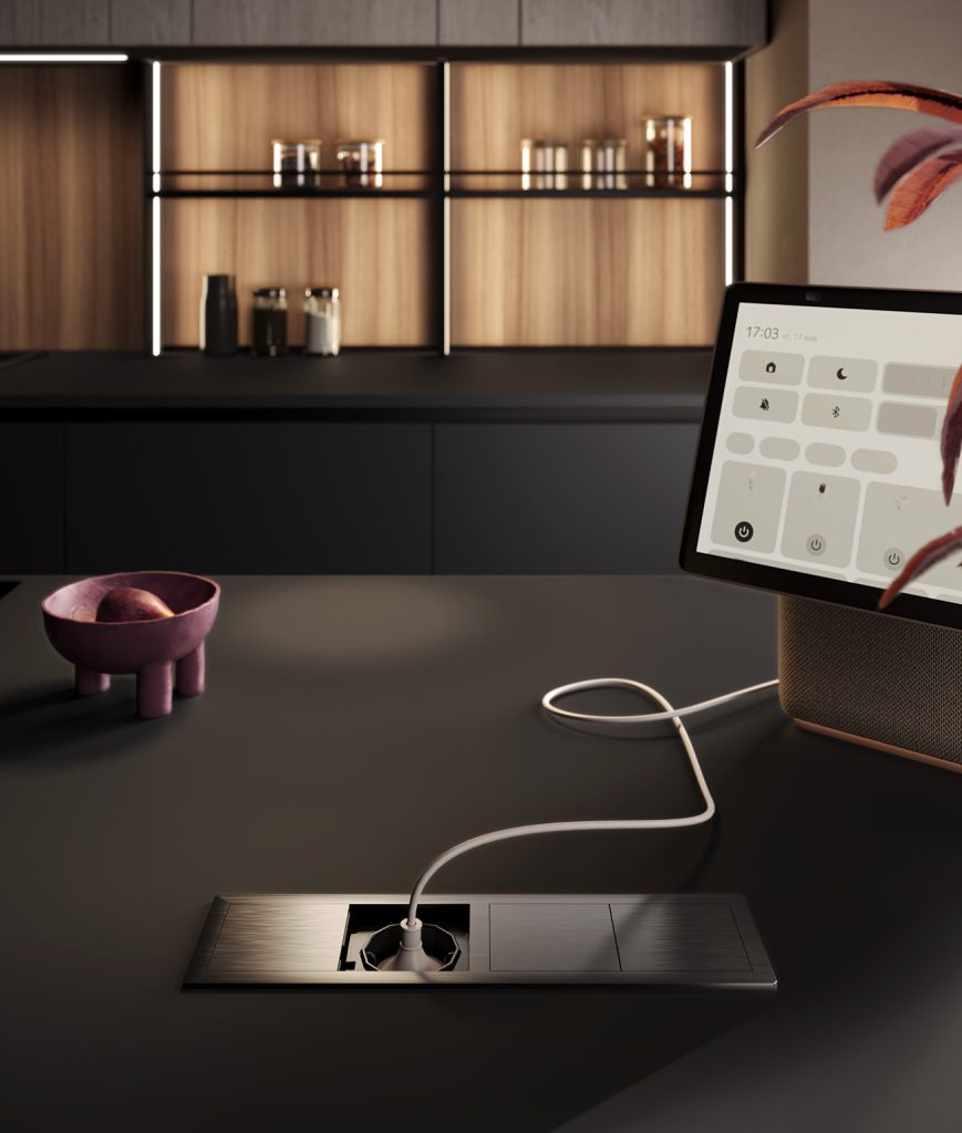 Ginevra Modern & Design kitchen by Ciao Cucine, detail of the pop-up socket in the worktop, light wood